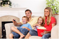 Family Sitting on Couch Watching TV Family_TV_Sm.jpg
